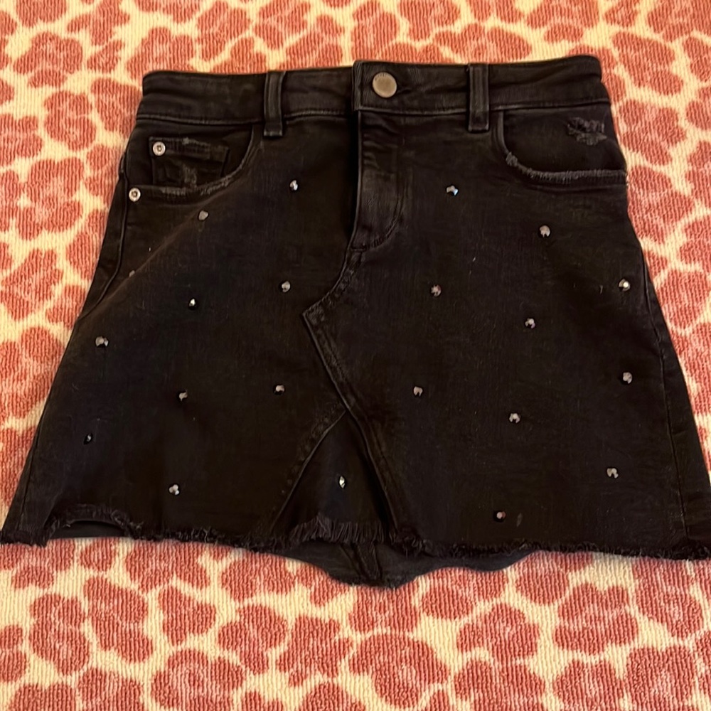 Black distressed denim miniskirt with rhinestones